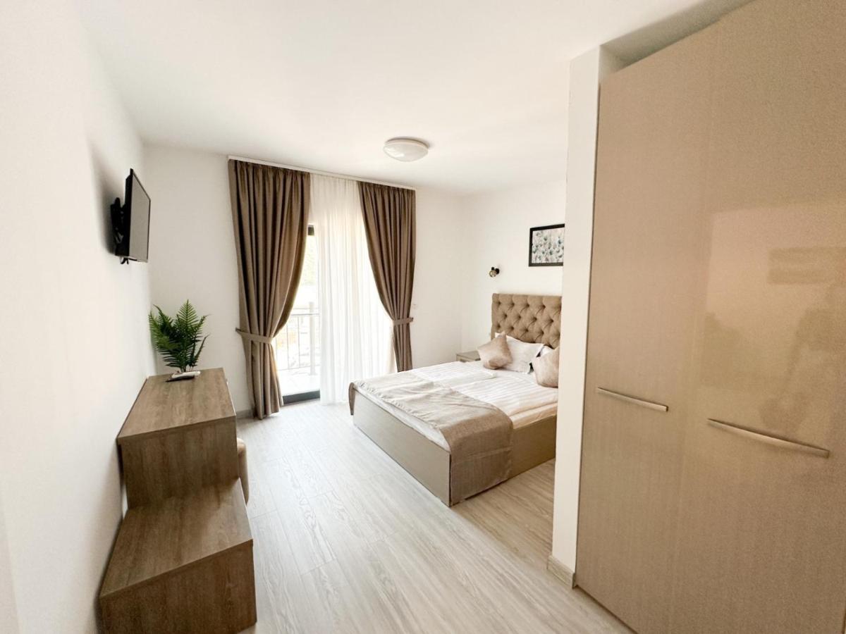 Modern white guest house at Partizan Resort with pool and Danube view