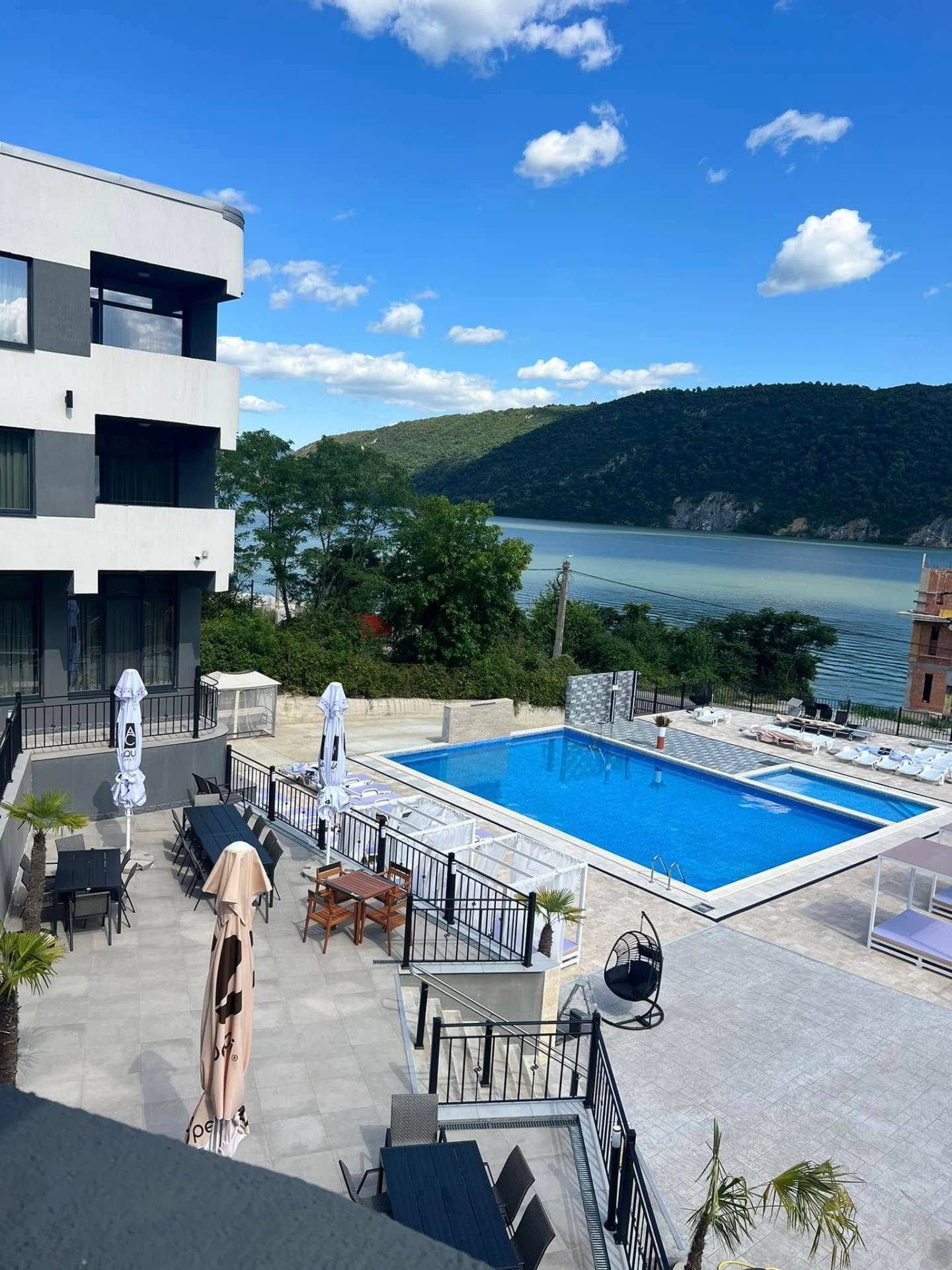 Two-level swimming pools at Partizan Resort with Danube view